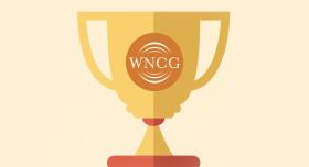 A golden trophy with the word wncg on it.
